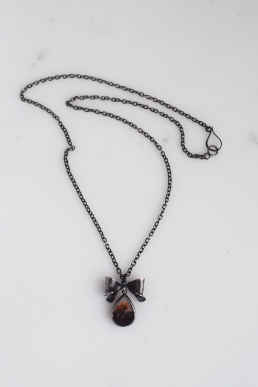 Bow and pear shaped dendritic agate necklace